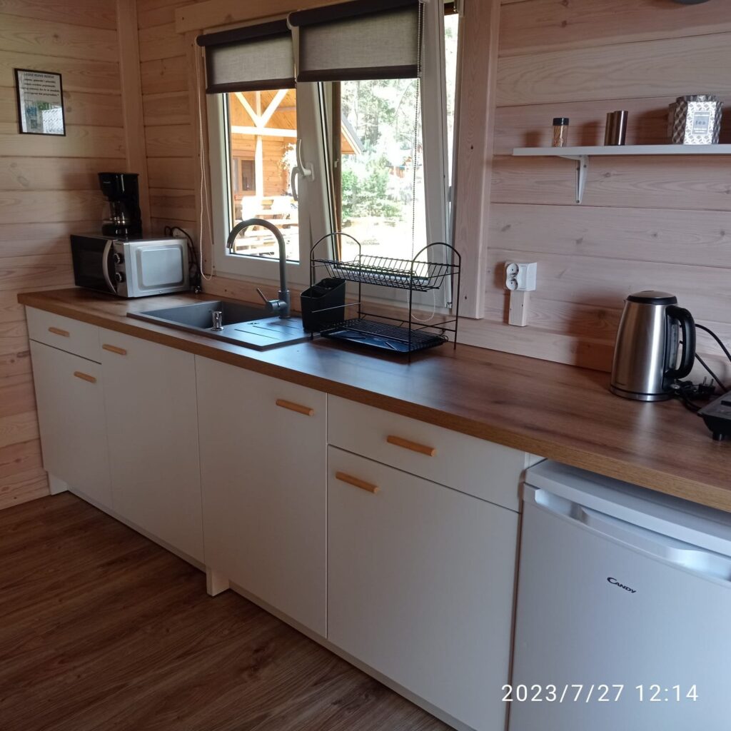 domek letniskowy, życie w lesie, komfort na wakacjach, prywatność, wypoczynek w domku, domki w Borach Tucholskich, noclegi Borsk, basen z podgrzewaną wodą